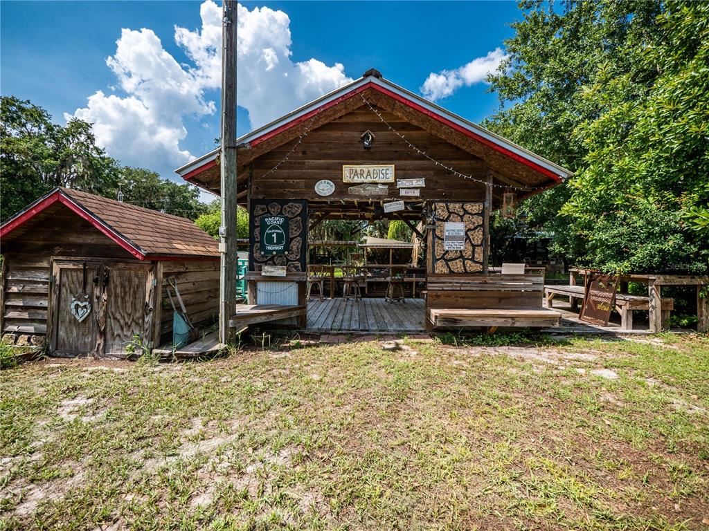 23673 Northeast 134th Lane Road Fort McCoy, FL 32134 - Photo 21 of 34 a view of a house with backyard porch and sitting area