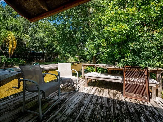 a view of a chairs and table on the wooden floor