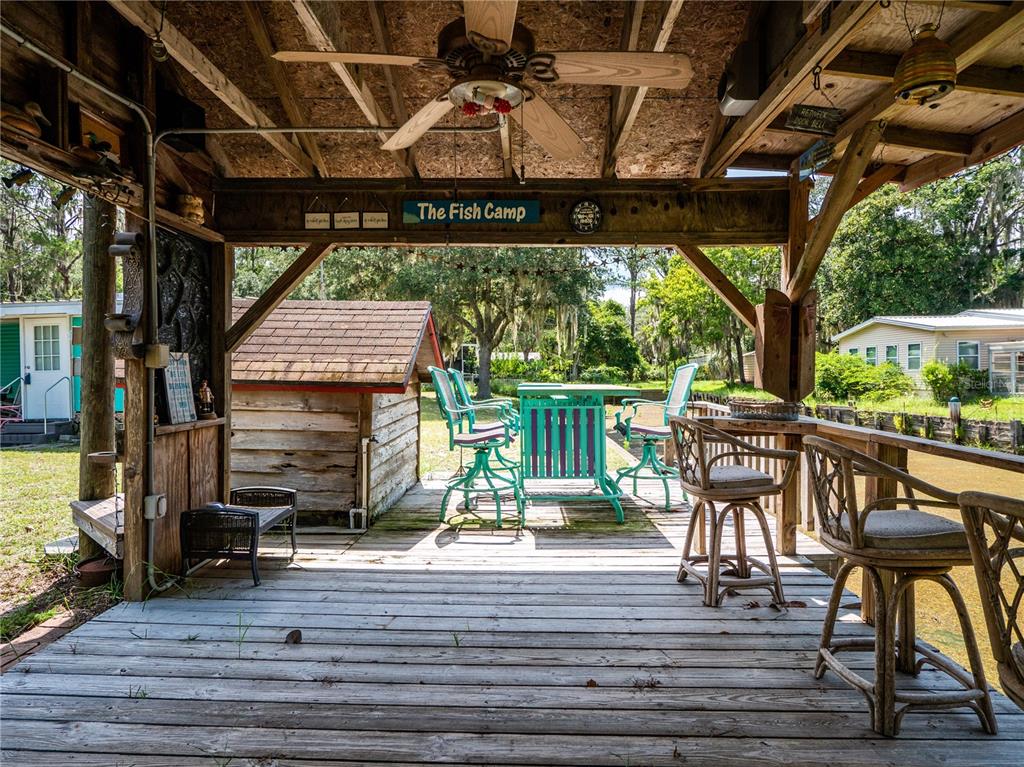 23673 Northeast 134th Lane Road Fort McCoy, FL 32134 - Photo 24 of 34 a view of a chairs and table on the wooden floor