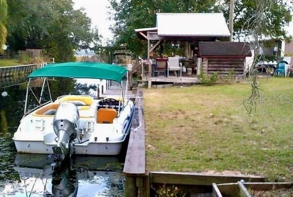a view of swimming pool with outdoor seating