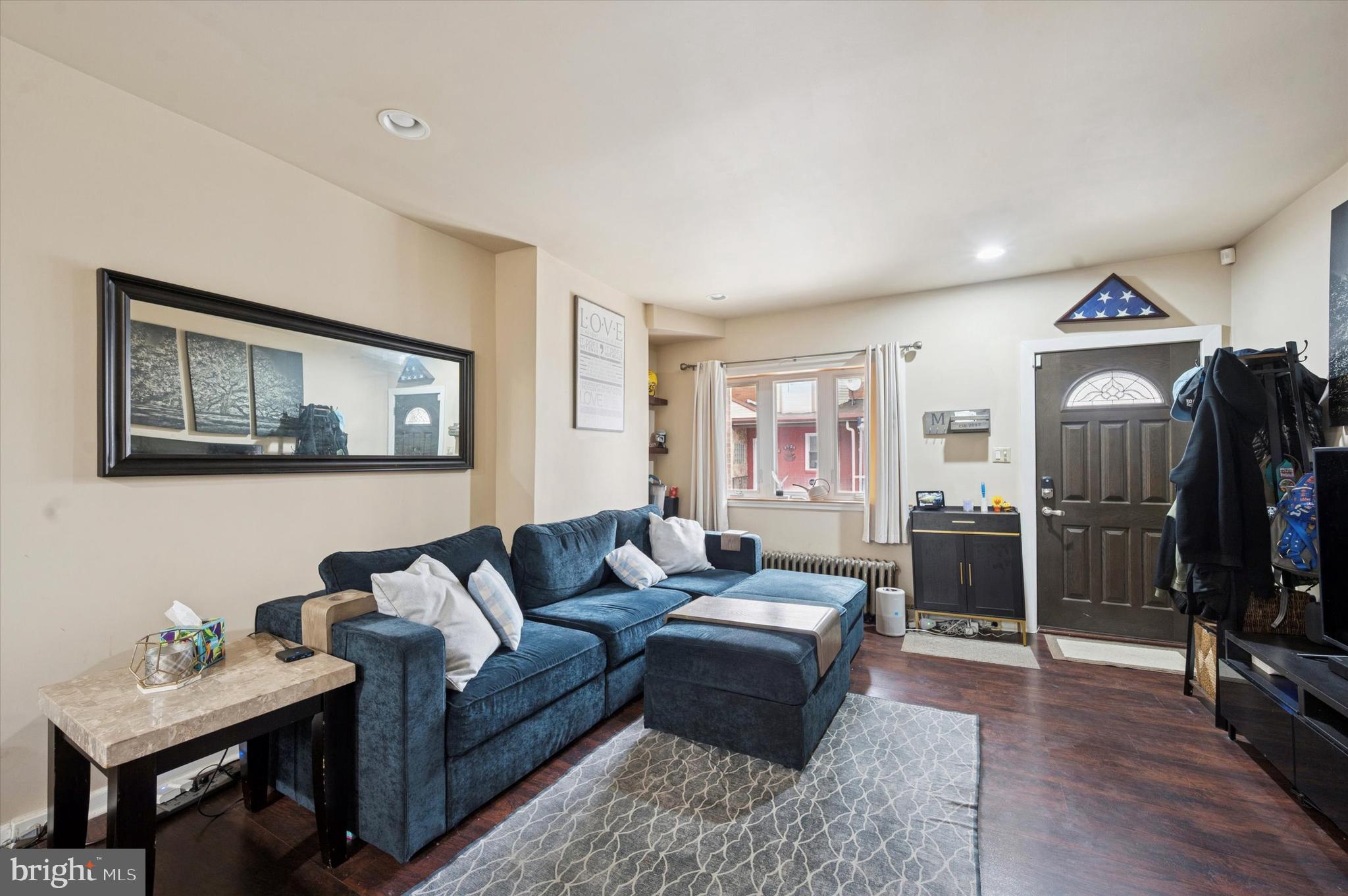 1404 North Felton Street Philadelphia, PA 19151 - Photo 3 of 15 a living room with furniture and a flat screen tv