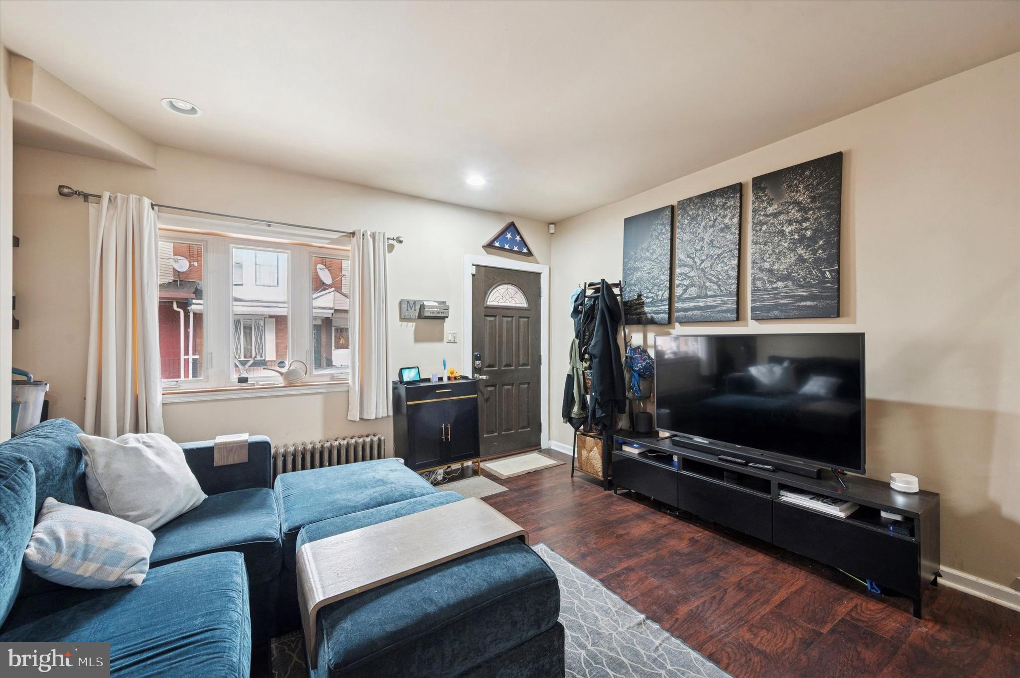 1404 North Felton Street Philadelphia, PA 19151 - Photo 4 of 15 a living room with furniture and a flat screen tv