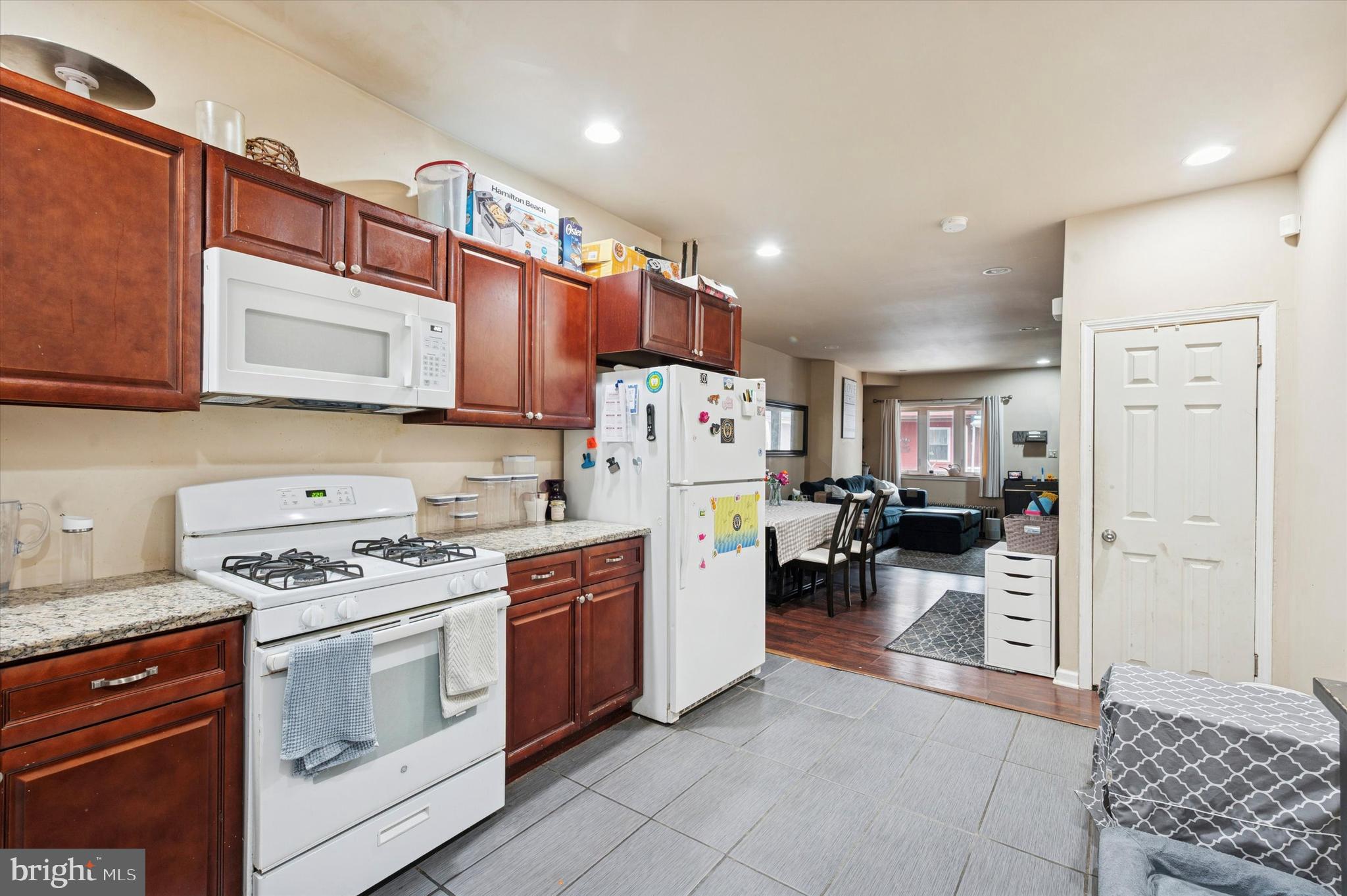 1404 North Felton Street Philadelphia, PA 19151 - Photo 9 of 15 a kitchen with a stove a sink and a refrigerator