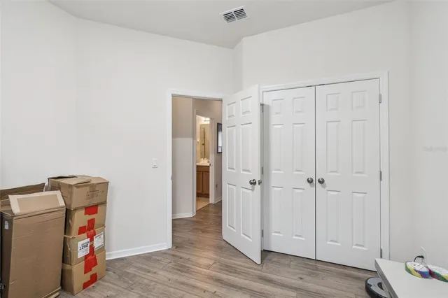 a view of a storage & utility room with wooden floor