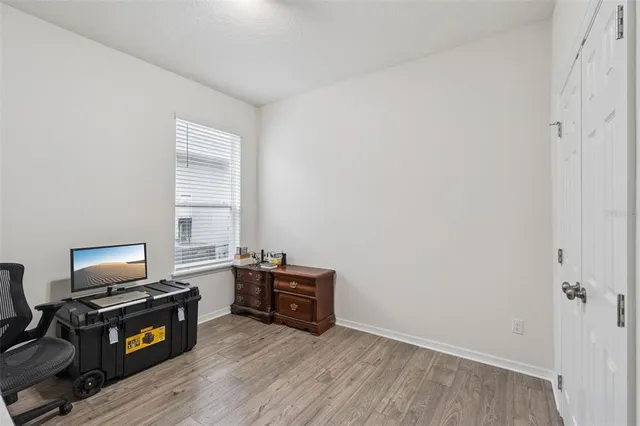 a view of workspace with wooden floor