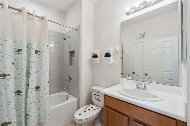 a bathroom with a sink toilet tub and shower