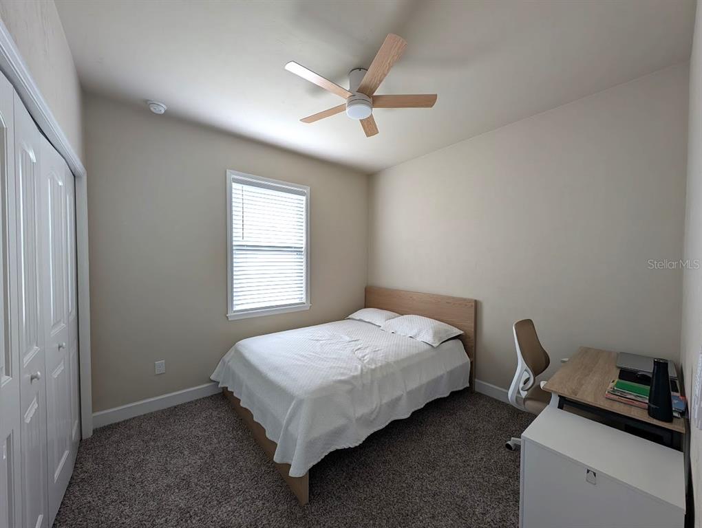1750 Southwest 246th Drive Newberry, FL 32669 - Photo 11 of 18 a bedroom with a bed and a window