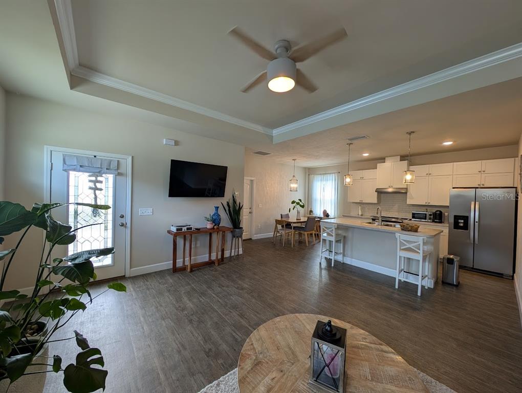 1750 Southwest 246th Drive Newberry, FL 32669 - Photo 5 of 18 a living room with furniture wooden floor and a flat screen tv