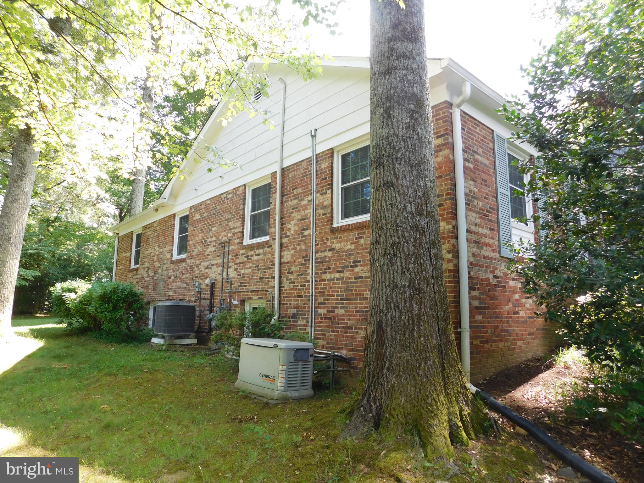 12123 Stirrup Road Reston, VA 20191 - Photo 42 of 53 Side of the home/Full windows in the basement.