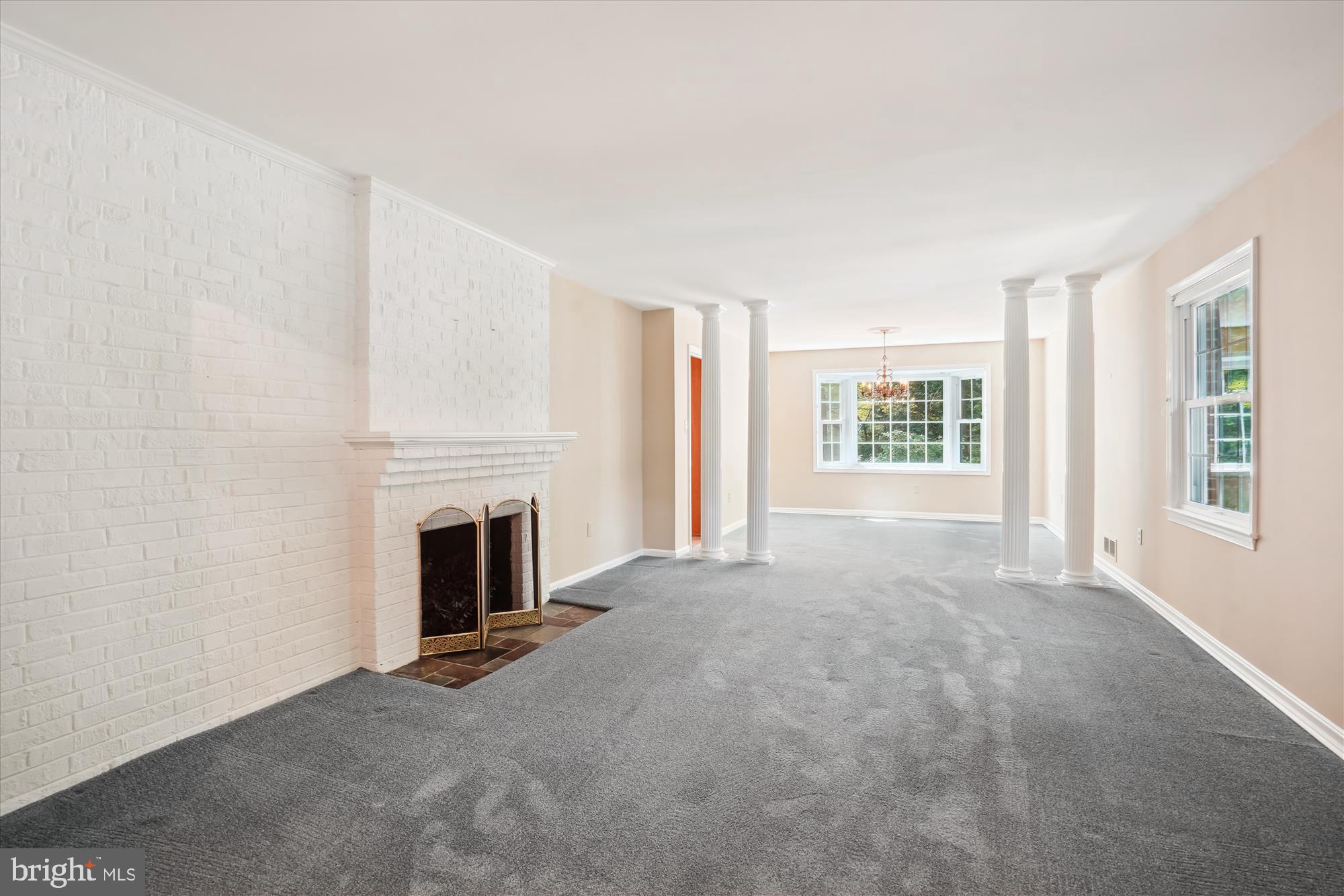 12123 Stirrup Road Reston, VA 20191 - Photo 9 of 53 Living Room to Dining with Woodburning Fireplace