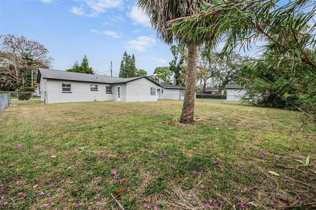 7802 Butler Avenue Hudson, FL 34667 - Photo 20 of 30 a house with a tree in front of it
