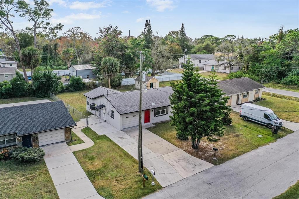 7802 Butler Avenue Hudson, FL 34667 - Photo 24 of 30 a aerial view of a house with a garden and plants