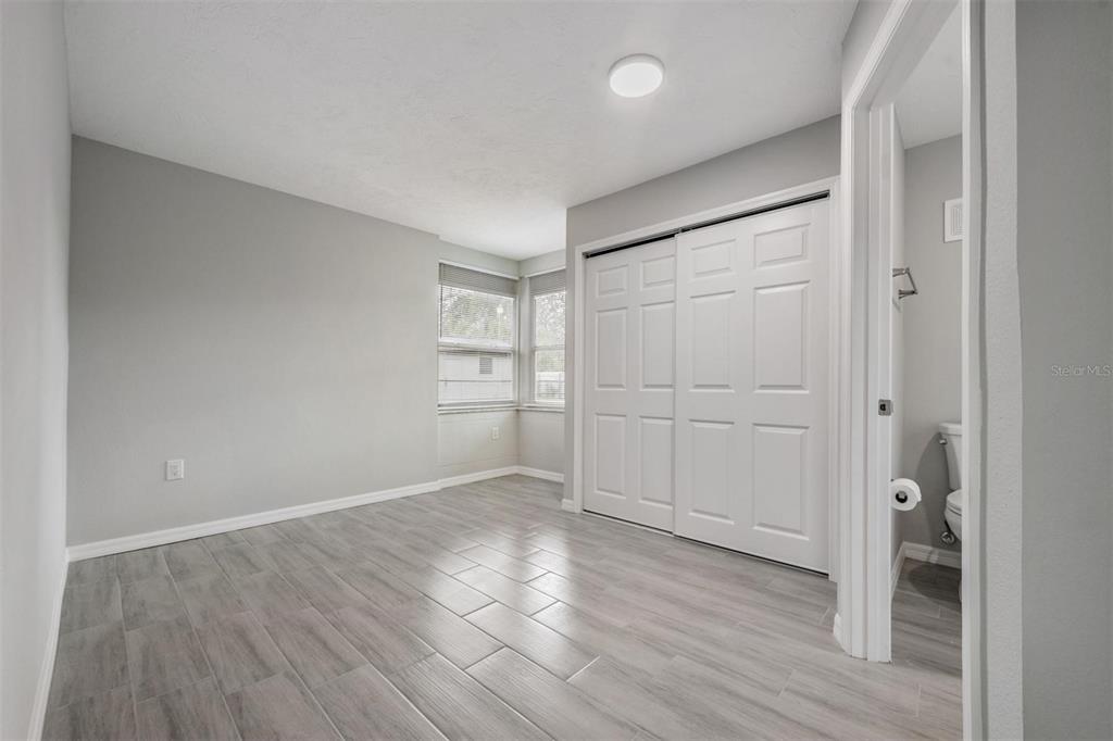 7802 Butler Avenue Hudson, FL 34667 - Photo 10 of 30 wooden floor in an empty room