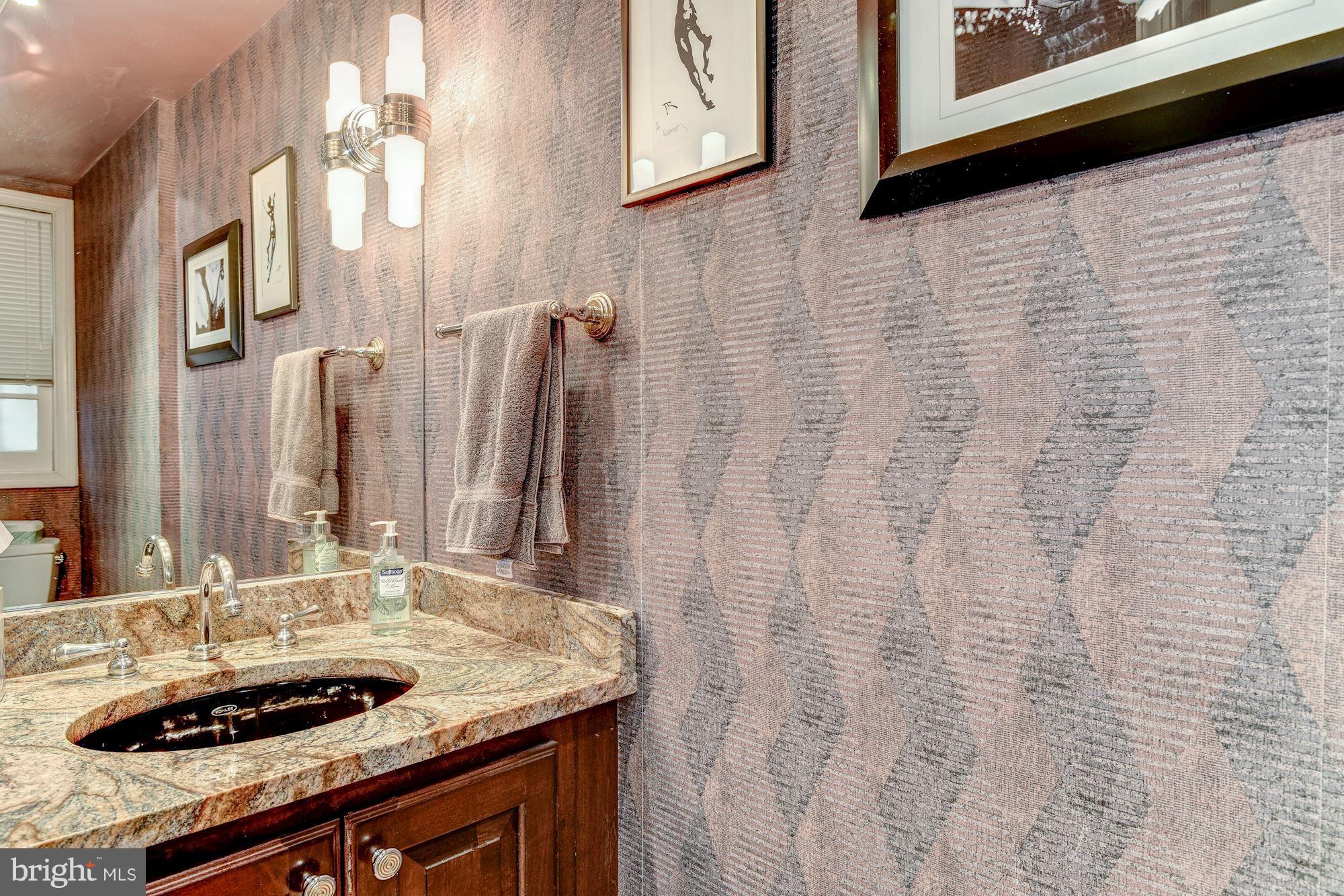 1610 32nd Street Northwest Washington, DC 20007 - Photo 17 of 27 a bathroom with a sink and a mirror