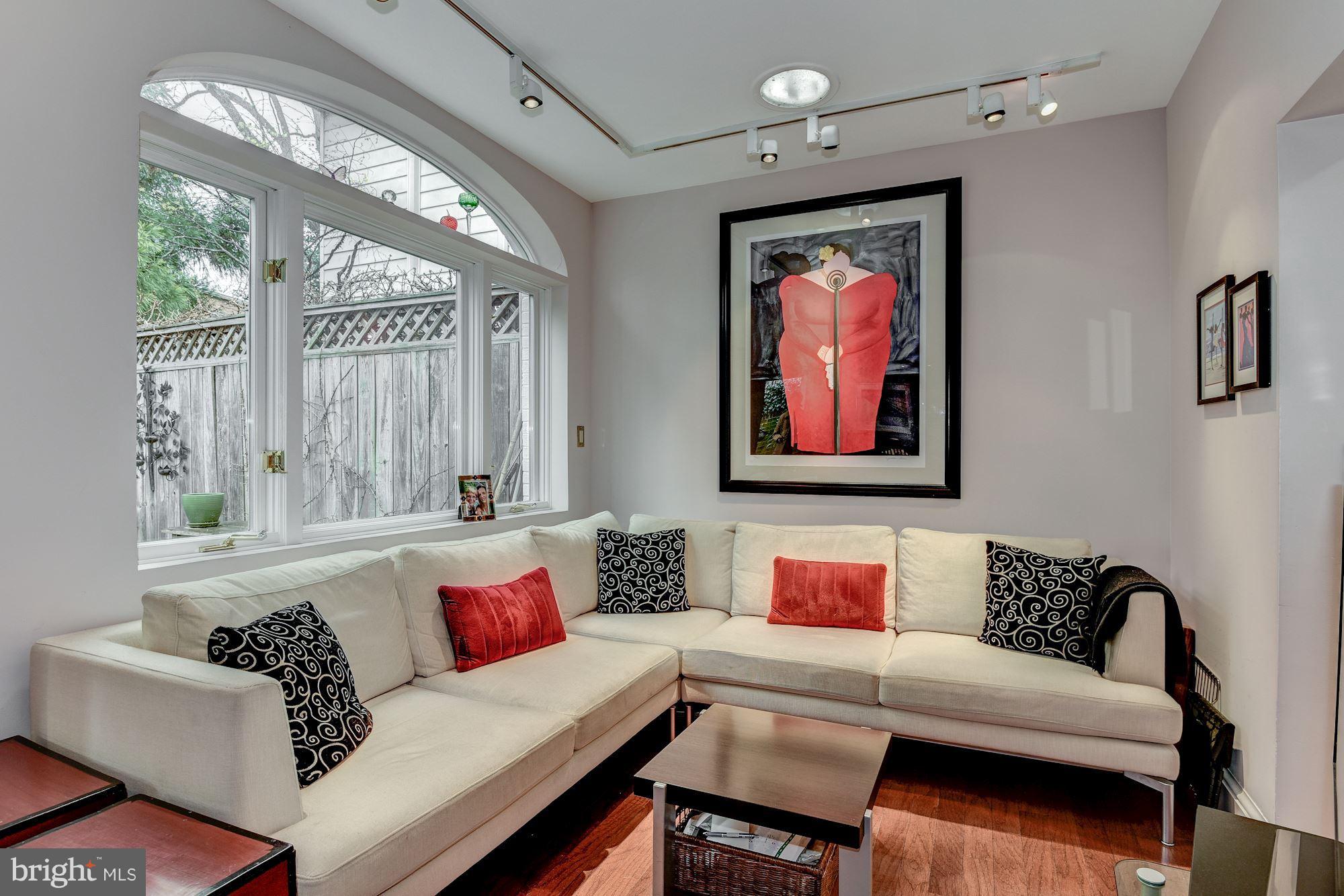 1610 32nd Street Northwest Washington, DC 20007 - Photo 20 of 27 a living room with furniture and a large window