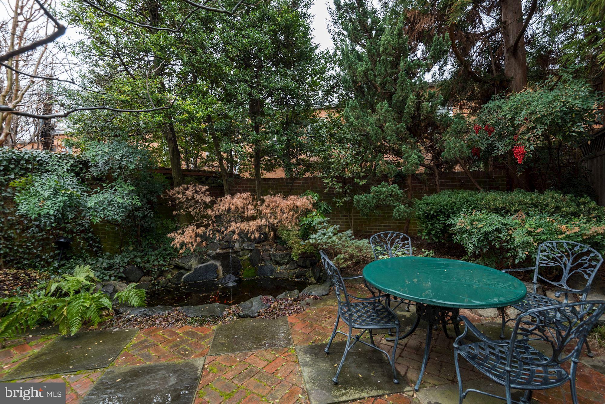 1610 32nd Street Northwest Washington, DC 20007 - Photo 24 of 27 a view of a chairs and table in backyard