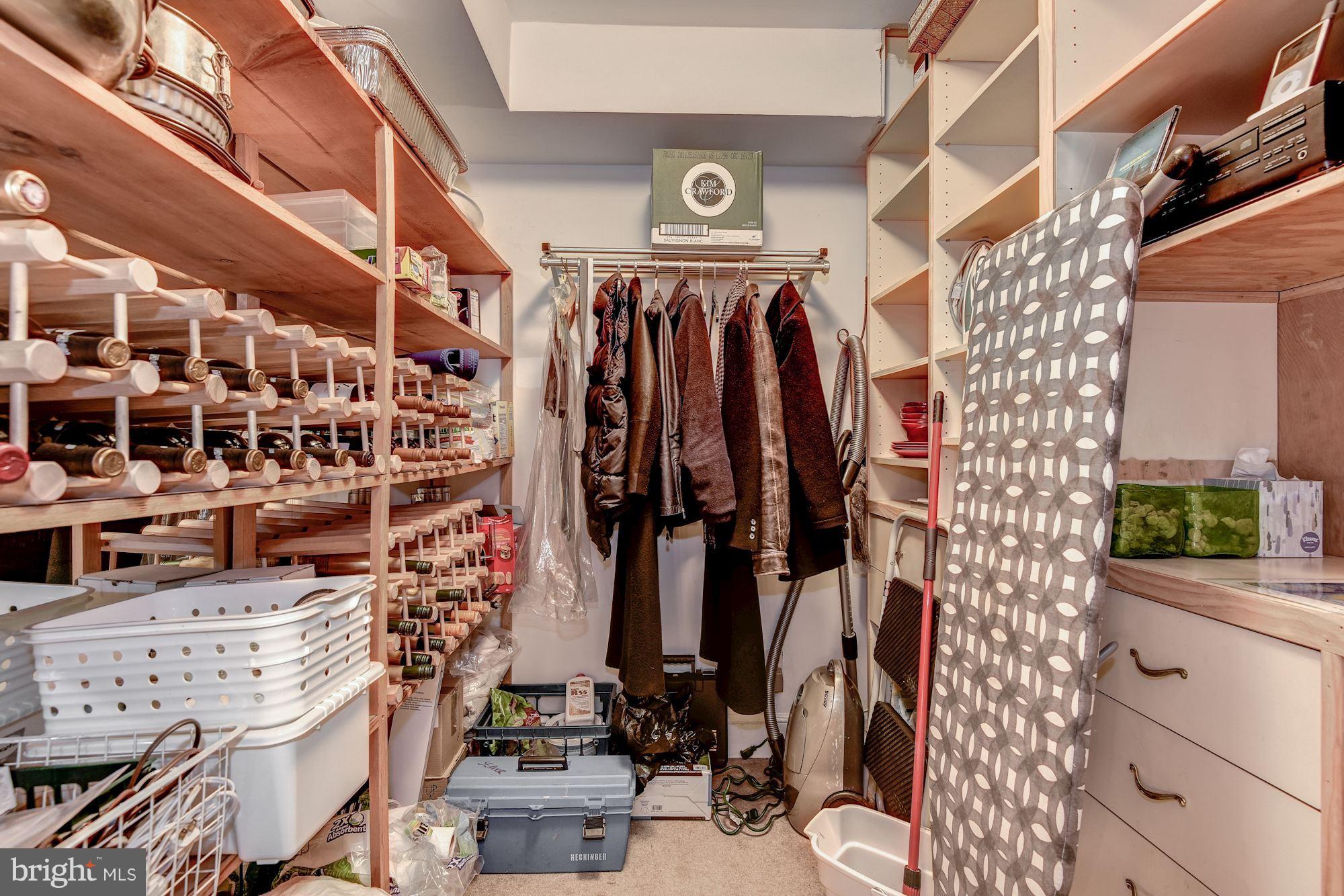 1610 32nd Street Northwest Washington, DC 20007 - Photo 26 of 27 a view of walk in closet with clothes and shoes