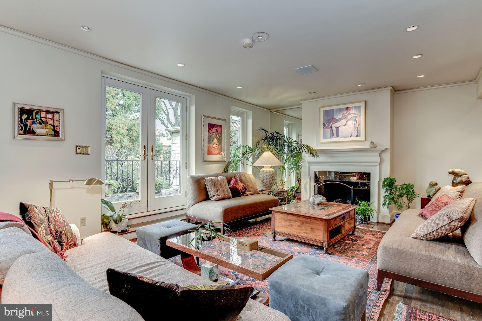 1610 32nd Street Northwest Washington, DC 20007 - Photo 4 of 27 a living room with furniture and a fireplace