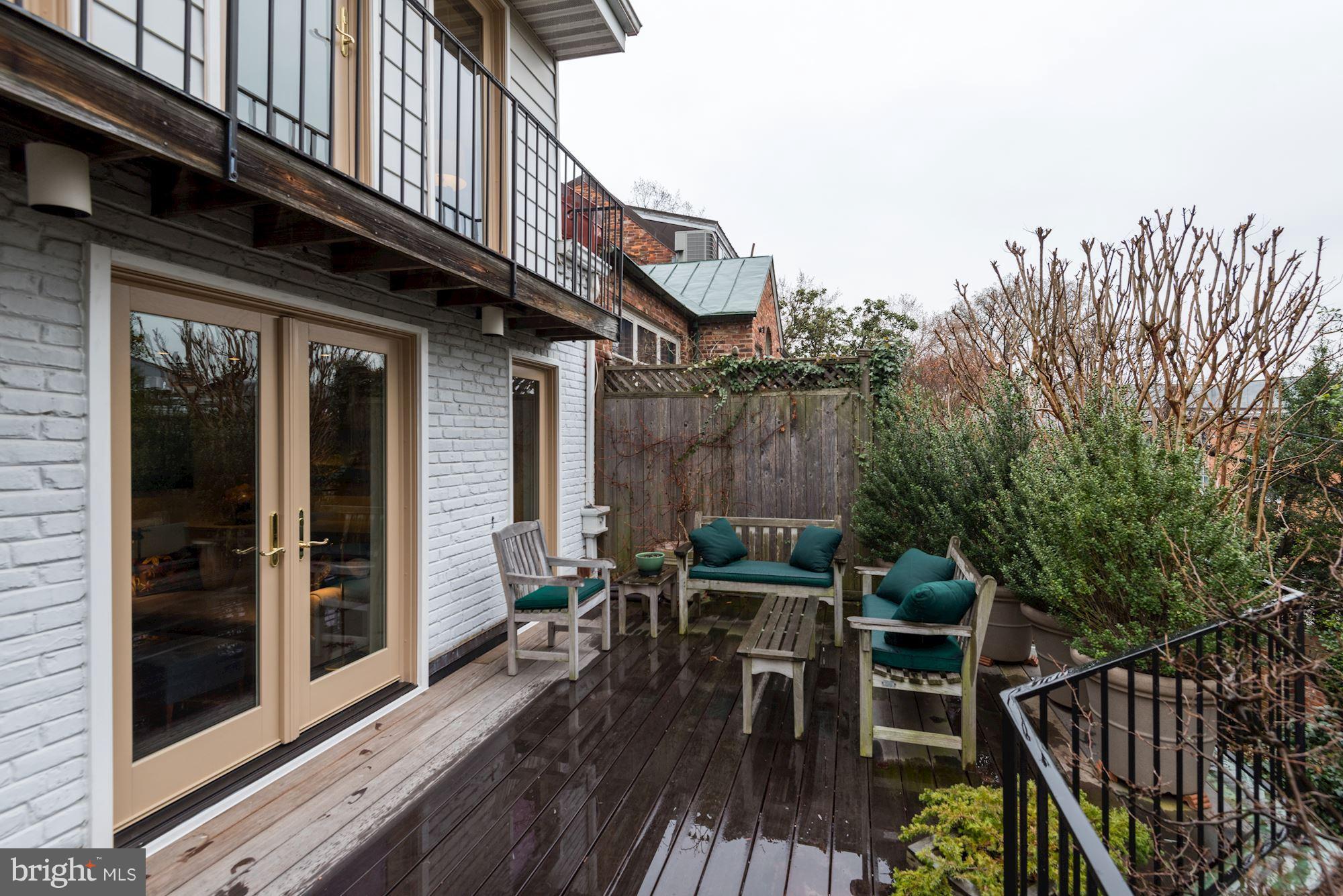 1610 32nd Street Northwest Washington, DC 20007 - Photo 7 of 27 a view of deck with table and chairs and wooden floor
