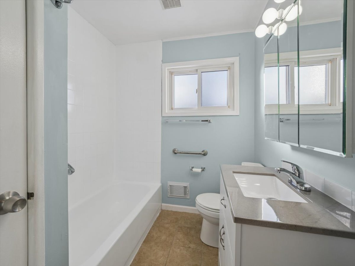 115 West Helen Road Palatine, IL 60067 - Photo 9 of 16 a bathroom with a sink toilet vanity and shower