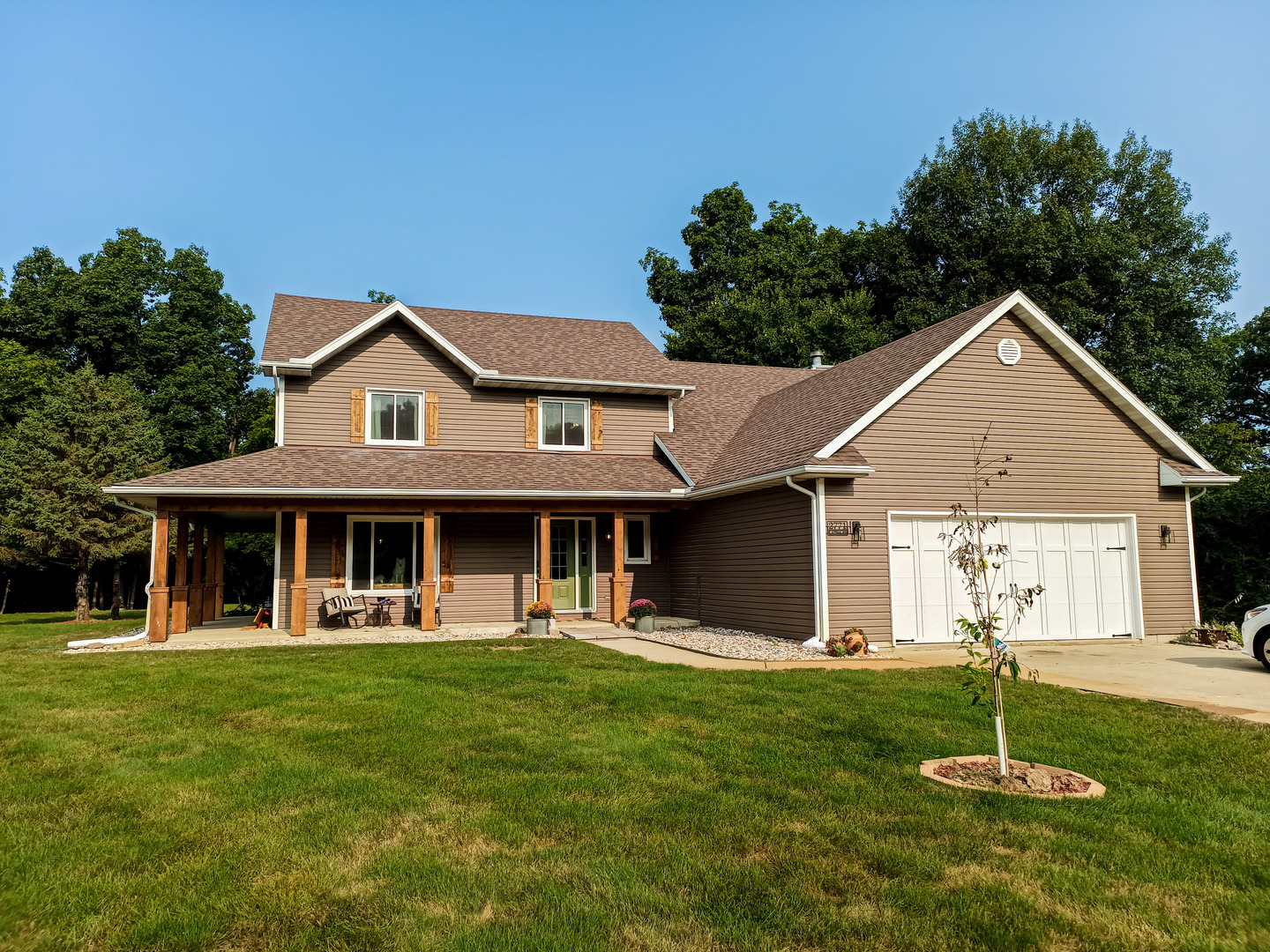 a front view of a house with a yard