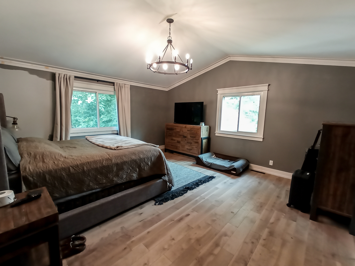 2771 East 1779th Road Ottawa, IL 61350 - Photo 14 of 36 a spacious bedroom with a bed window and a chandelier
