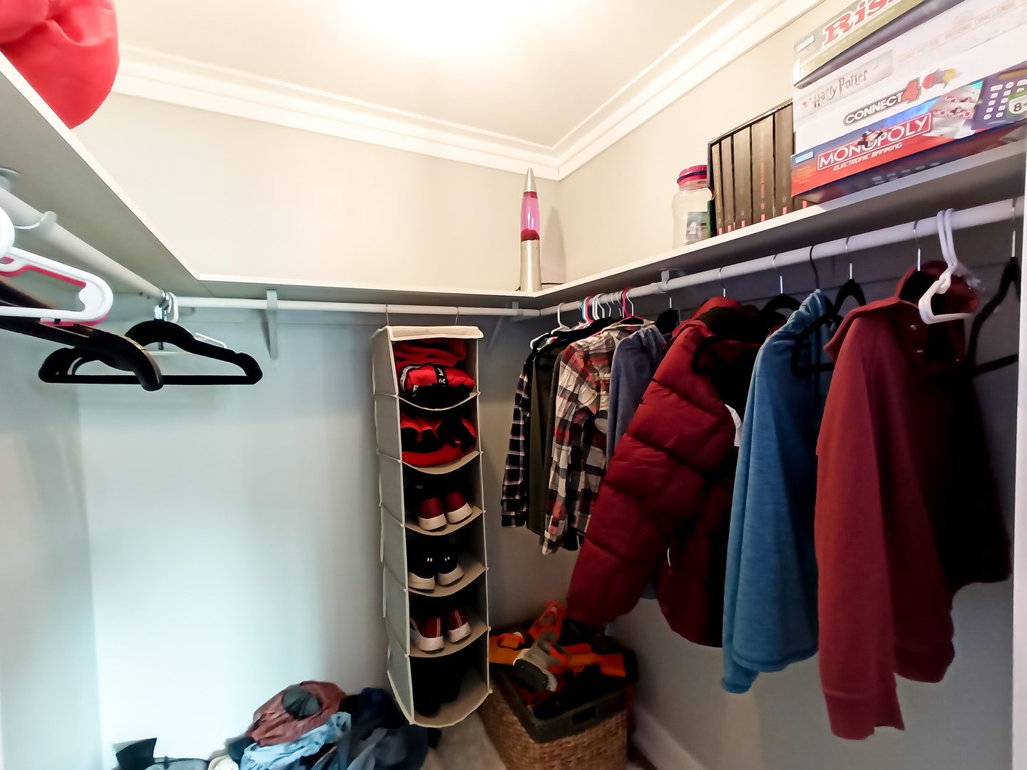 2771 East 1779th Road Ottawa, IL 61350 - Photo 28 of 36 a view of walk in closet with clothes and shoes