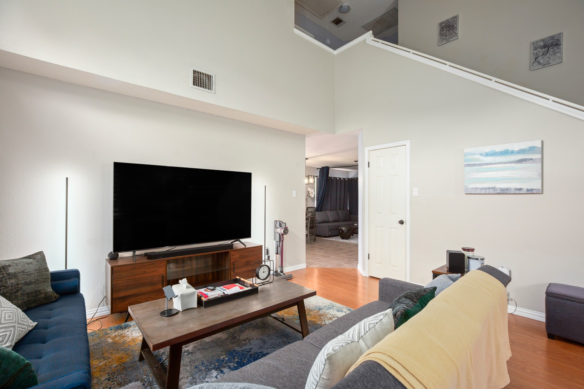 13803 Randalstone Drive Pflugerville, TX 78660 - Photo 7 of 27 Living area with wood finished floors and a high ceiling