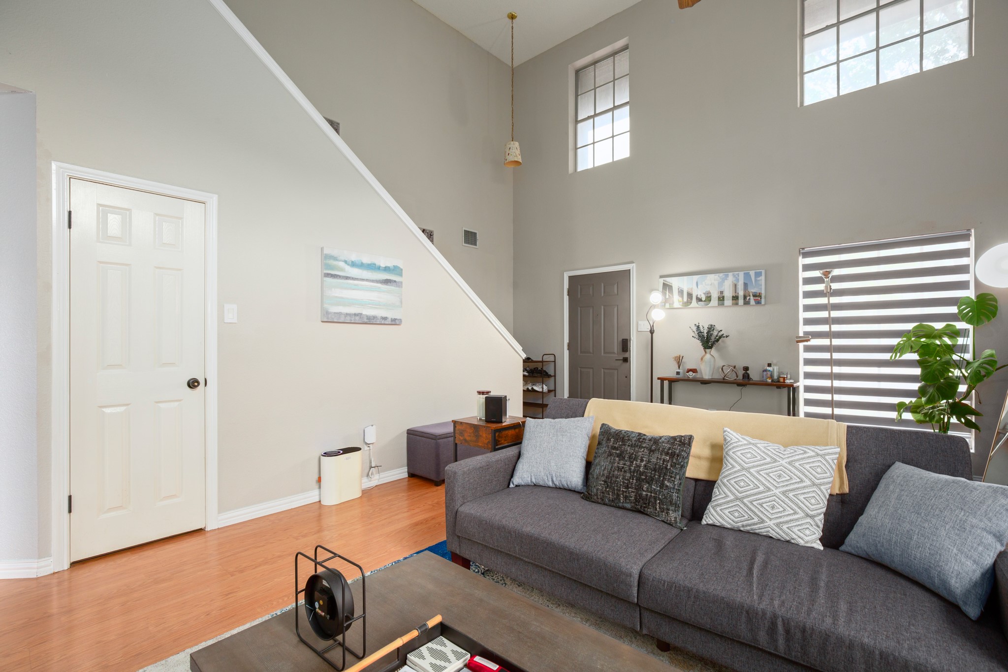 13803 Randalstone Drive Pflugerville, TX 78660 - Photo 9 of 27 Living room featuring wood finished floors and a high ceiling