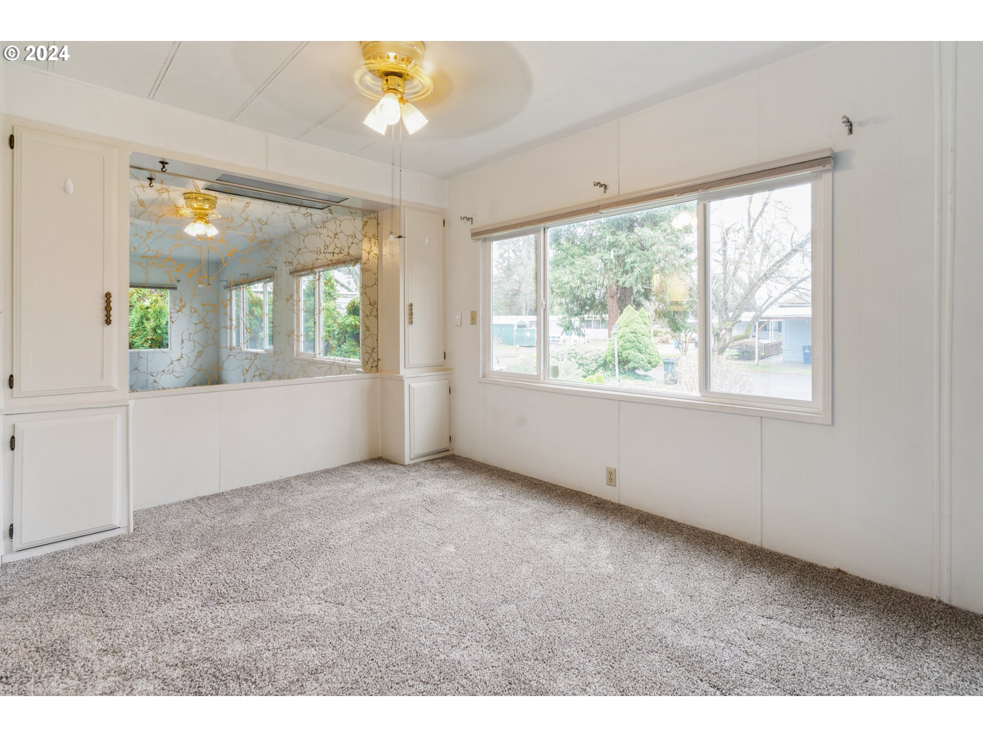 1125 58th Street, Unit 1 Springfield, OR 97478 - Photo 8 of 22 a view of an empty room with a window