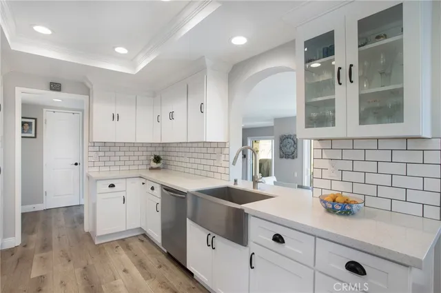 a kitchen with a sink and a stove