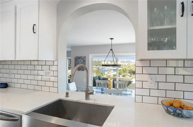 a kitchen with stainless steel appliances a refrigerator stove and sink