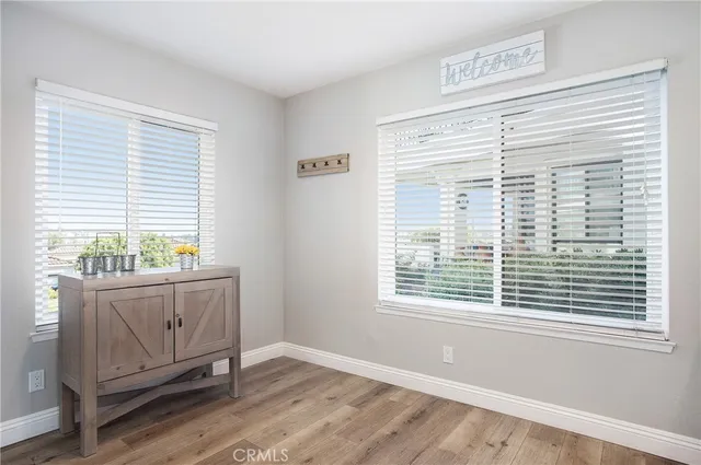 a view of a glass door with a yard from a window