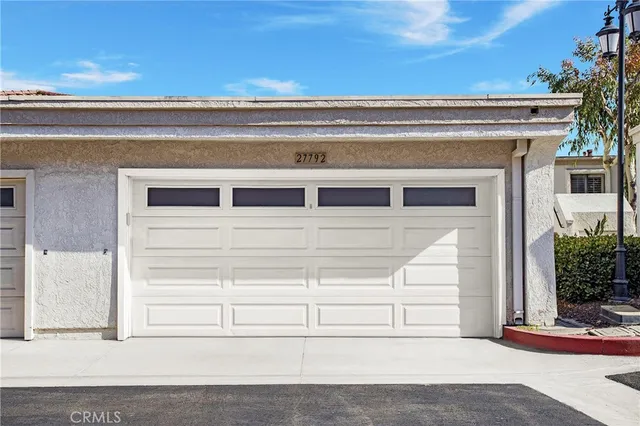 a view of roof deck with furniture