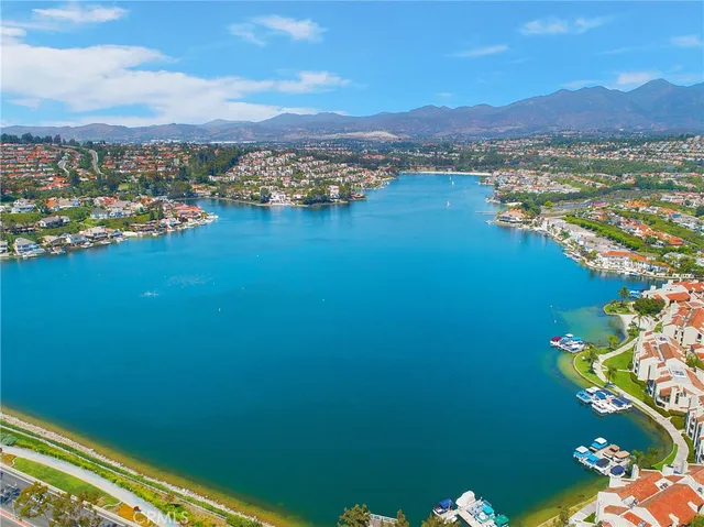 a view of a house with patio and a yard