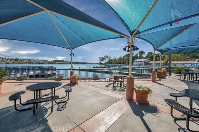a view of a swimming pool with outdoor seating