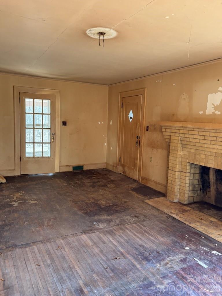 5724 Mooresville Road Kannapolis, NC 28081 - Photo 9 of 15 an empty room with windows and fireplace