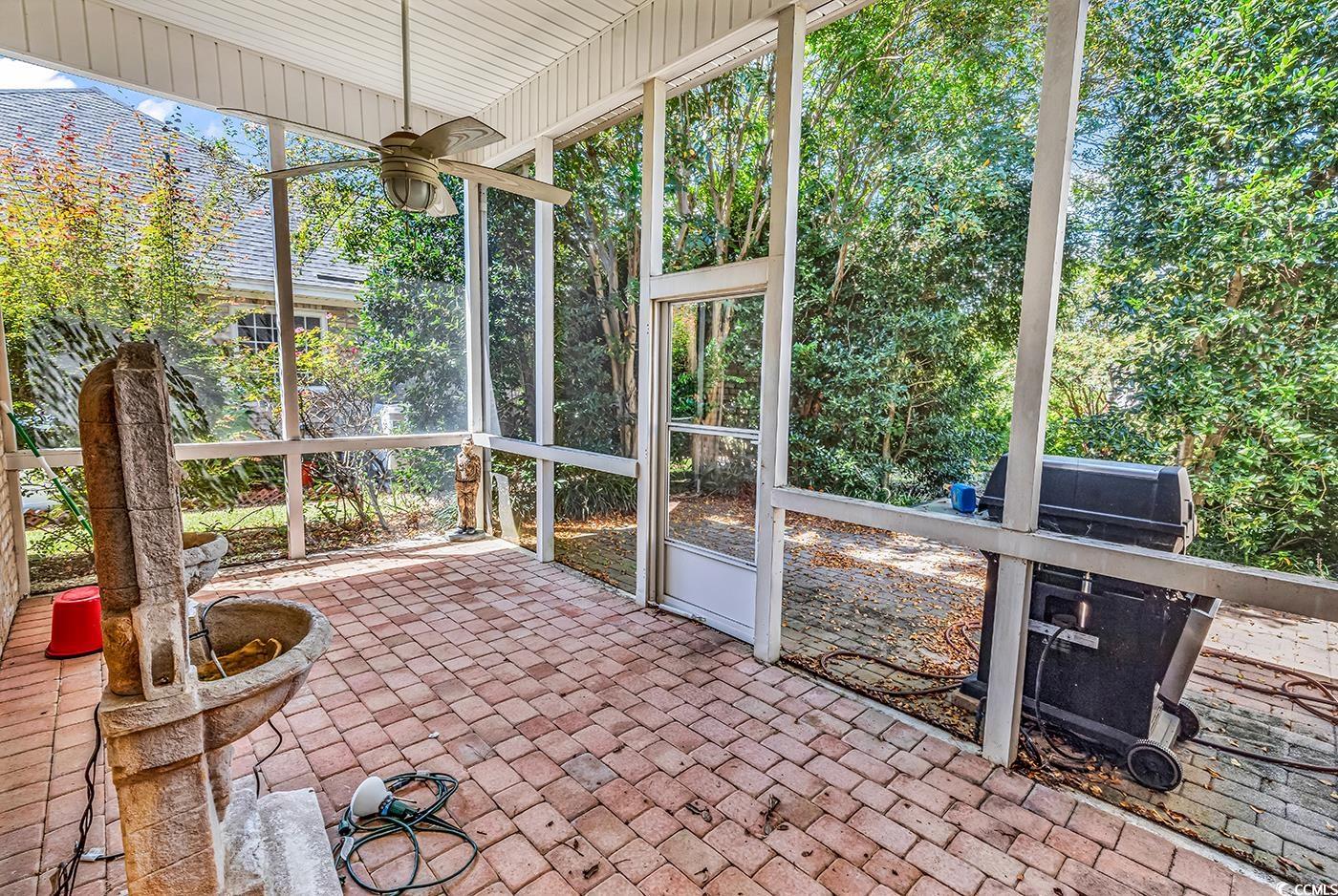 553 Linton Park Road Myrtle Beach, SC 29579 - Photo 28 of 40 Unfurnished sunroom featuring a ceiling fan and a patio