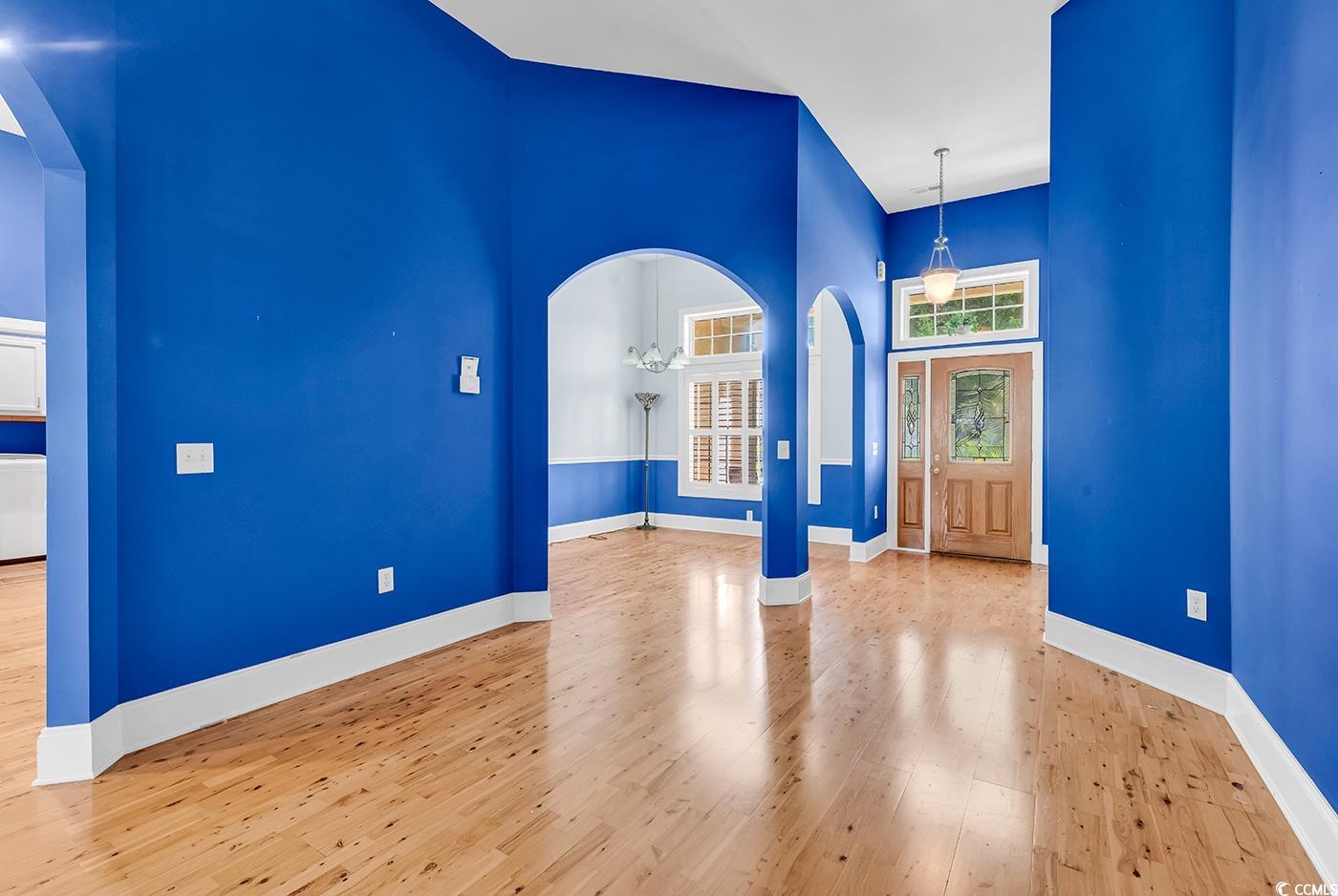 553 Linton Park Road Myrtle Beach, SC 29579 - Photo 4 of 40 Entryway featuring arched walkways, light wood finished floors, and a towering ceiling