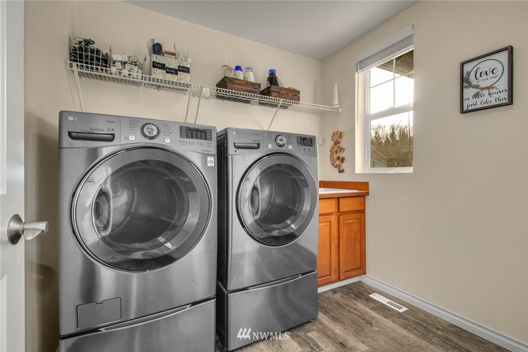 27752 Maple Ridge Way Southeast Maple Valley, WA 98038 - Photo 12 of 25 a close up view of a washer and dryer in a utility room