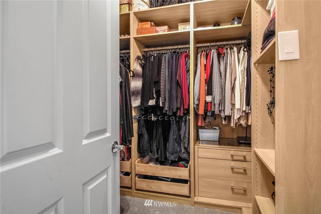 27752 Maple Ridge Way Southeast Maple Valley, WA 98038 - Photo 15 of 25 a view of walk in closet with clothes