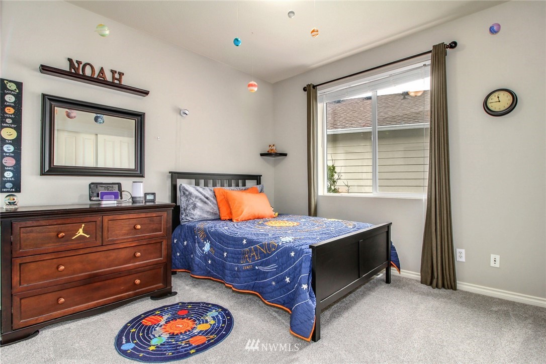 27752 Maple Ridge Way Southeast Maple Valley, WA 98038 - Photo 20 of 25 a bedroom with a bed and a window