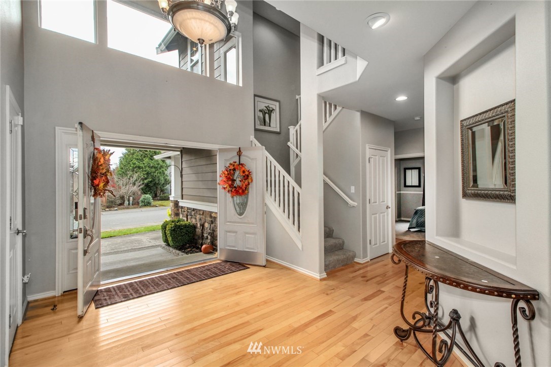 27752 Maple Ridge Way Southeast Maple Valley, WA 98038 - Photo 3 of 25 workspace with wooden floor and windows