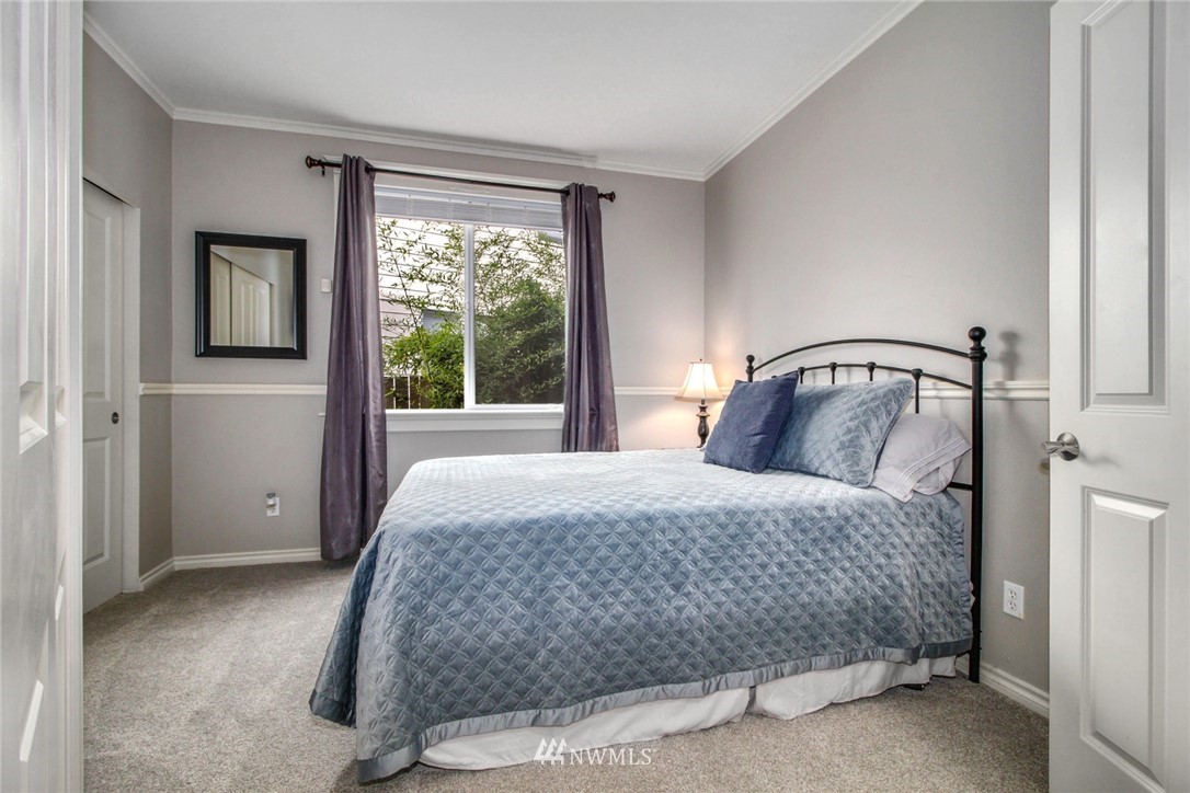 27752 Maple Ridge Way Southeast Maple Valley, WA 98038 - Photo 10 of 25 a bedroom with a bed and window