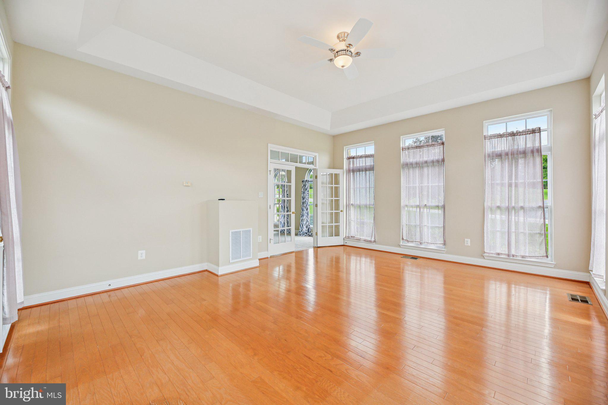 705 Jaclyn Circle Freeland, MD 21053 - Photo 17 of 45 a view of an empty room with a window and wooden floor