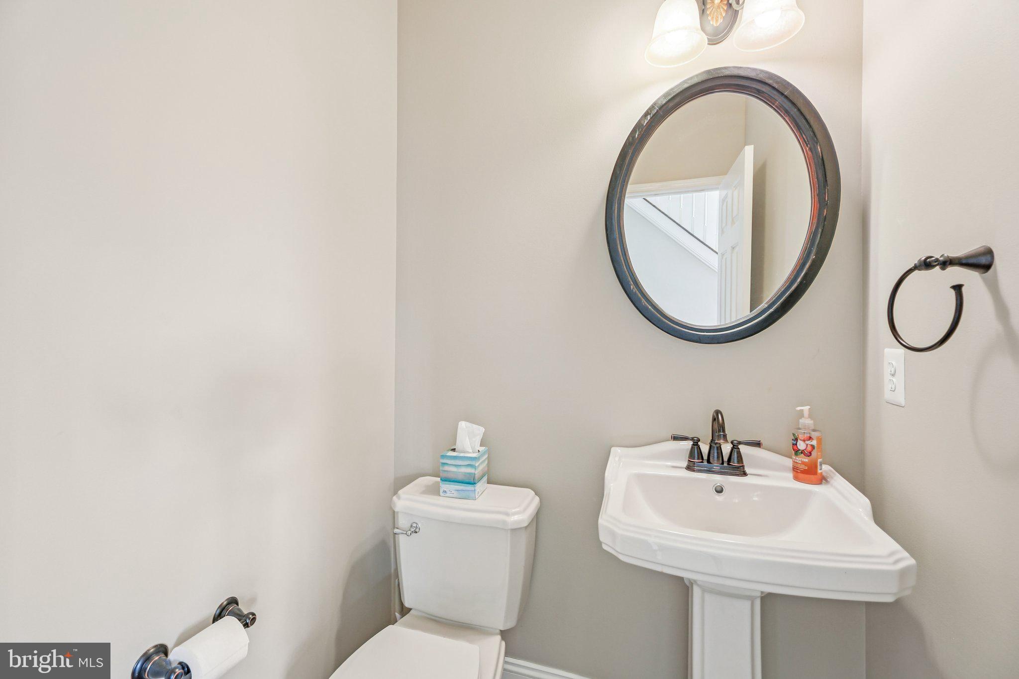 705 Jaclyn Circle Freeland, MD 21053 - Photo 20 of 45 a bathroom with a toilet sink and mirror