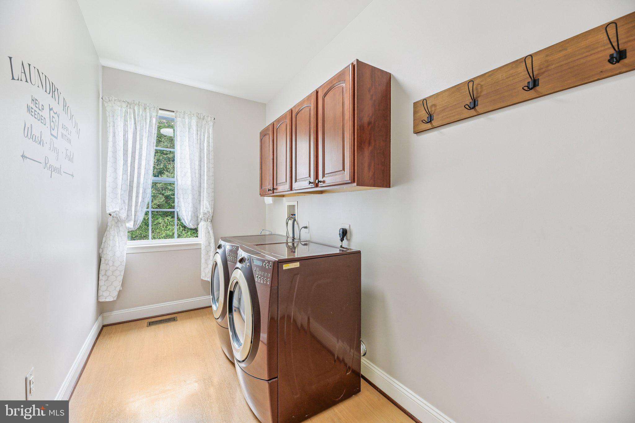 705 Jaclyn Circle Freeland, MD 21053 - Photo 21 of 45 a utility room with cabinets and a window