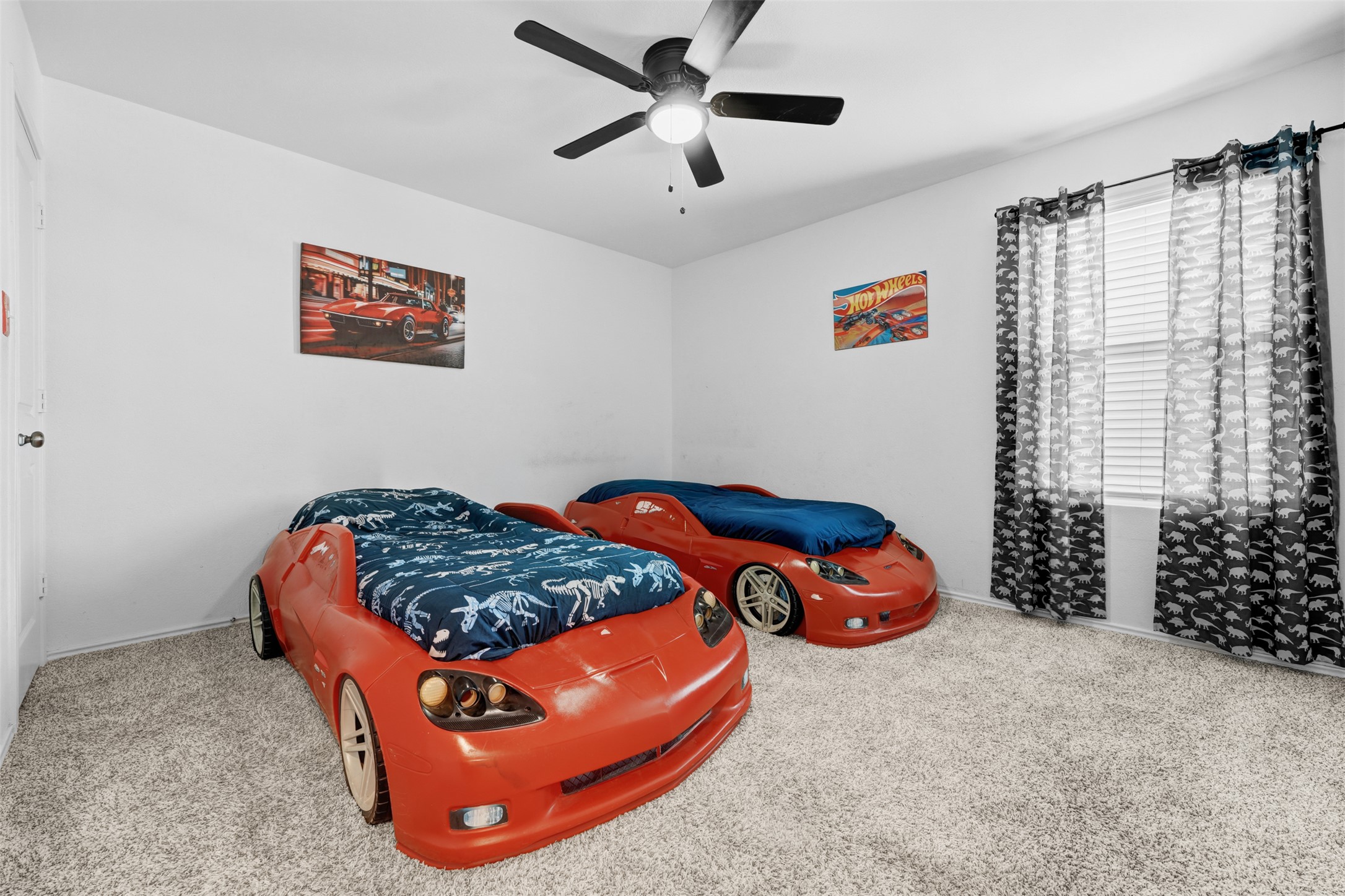 413 Perfect World Loop Jarrell, TX 76537 - Photo 29 of 39 Car-themed bedroom with soft carpet and natural light from a window.