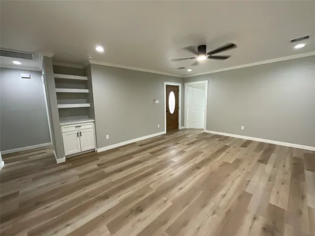 a view of an empty room with a window