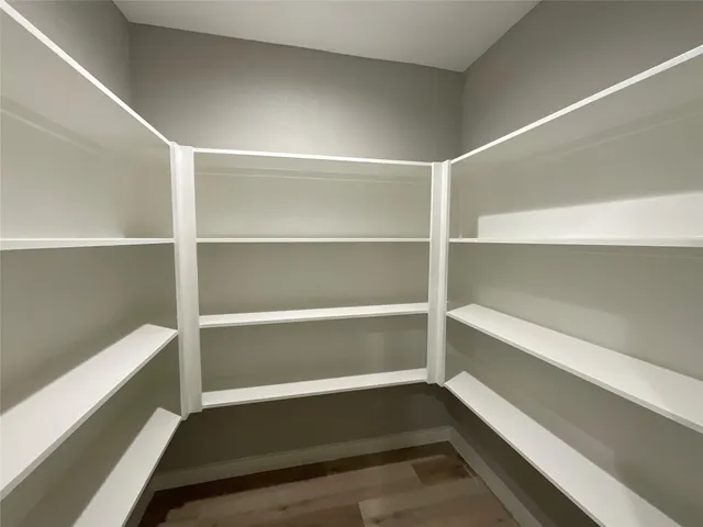 a view of kitchen with sink and wooden floor